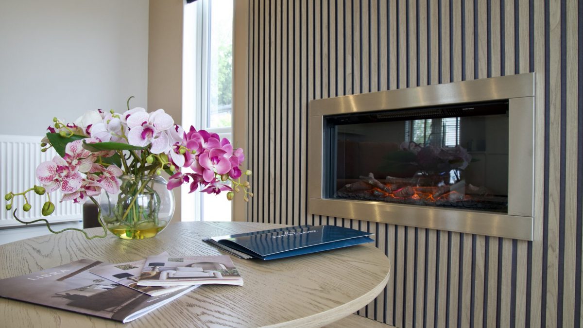 electric modern fireplace with wood panelled design and coffee table