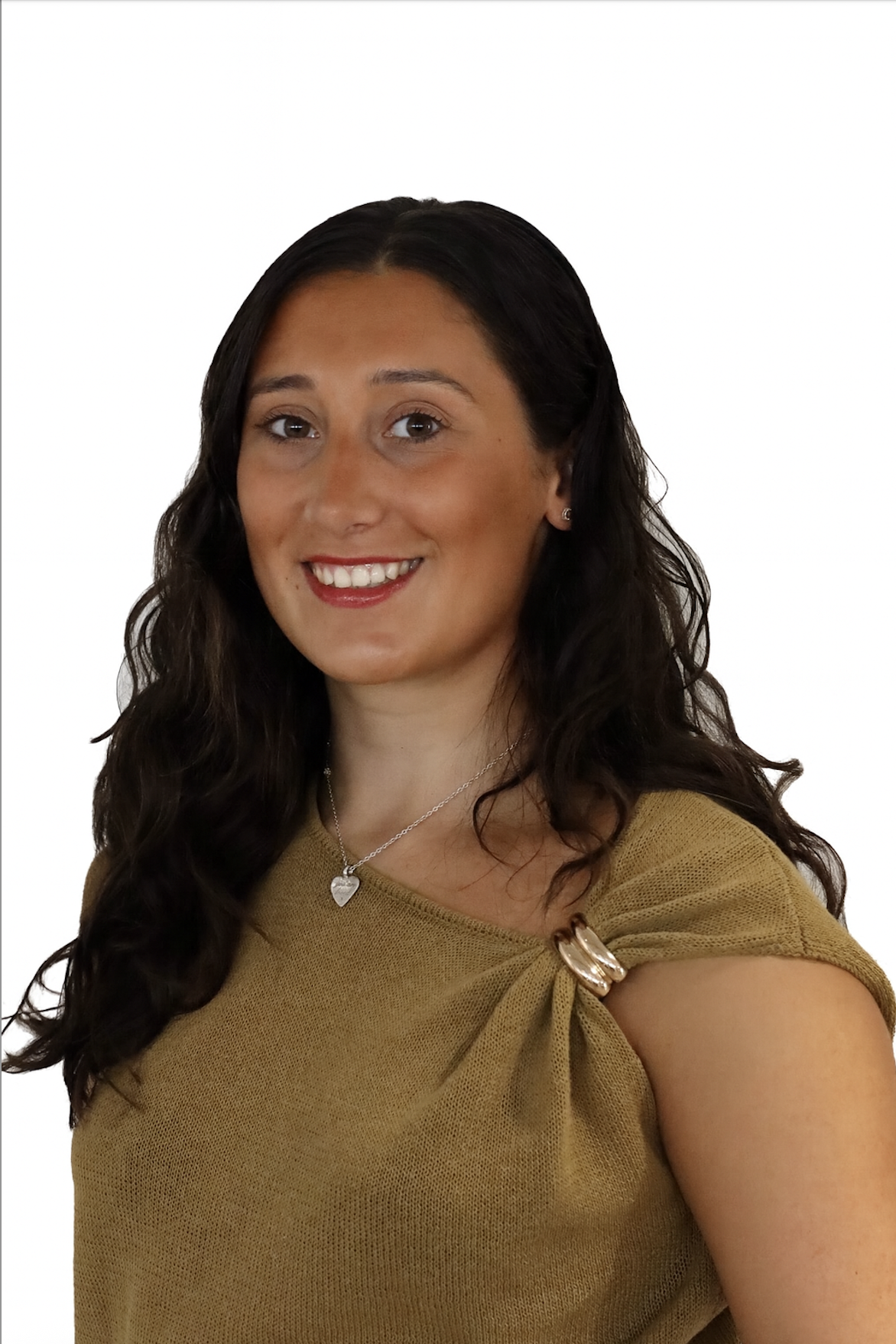 brown haired girl smiling with a white background
